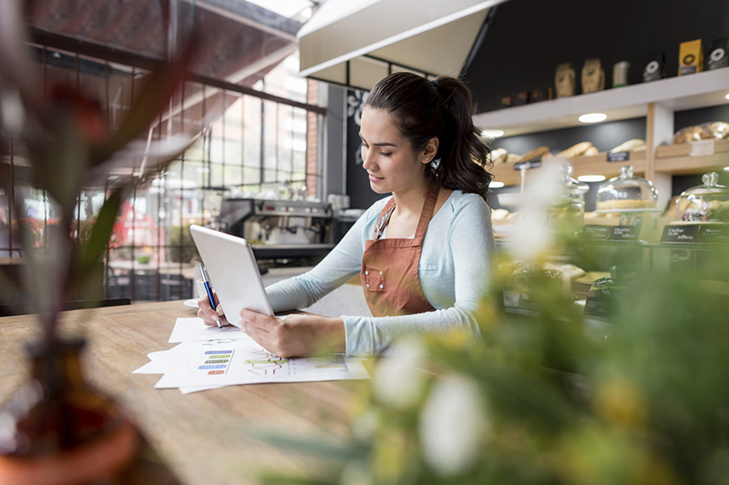 Business owner looking at tablet