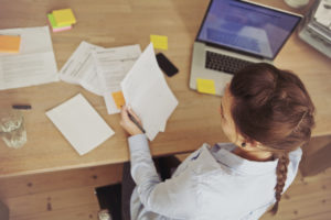 Businesswomen reviewing paperwork