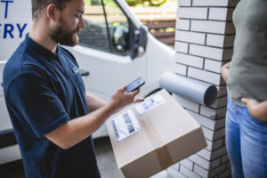 Scanning the bar code on a package