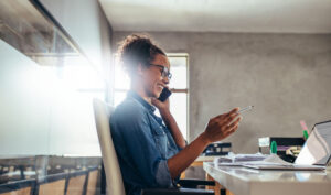 Woman in an office discussing the best OnPay competitors and alternatives