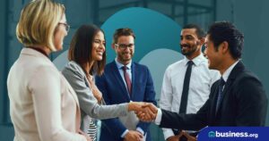 group of people with two shaking hands on abstract background