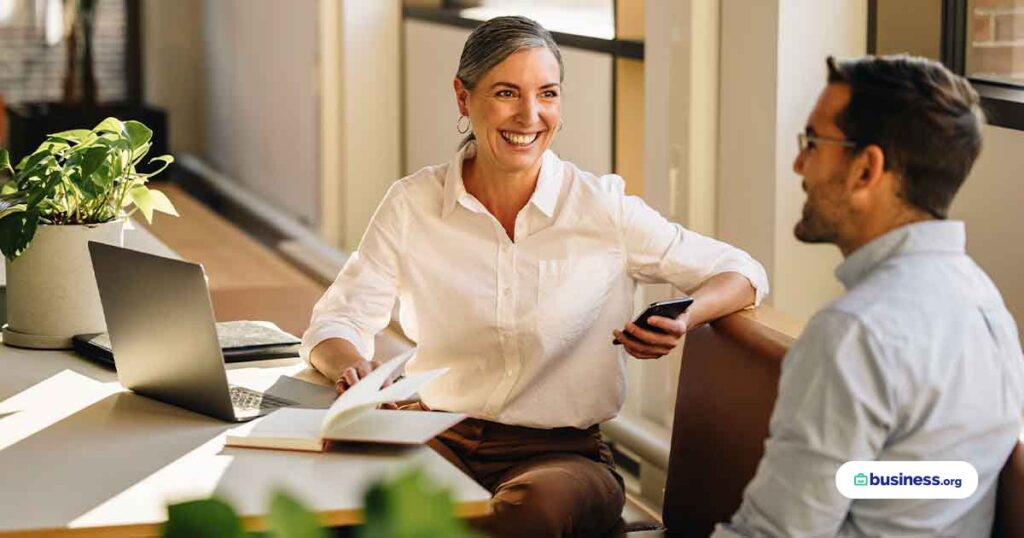 two-business-people-talking-in-office